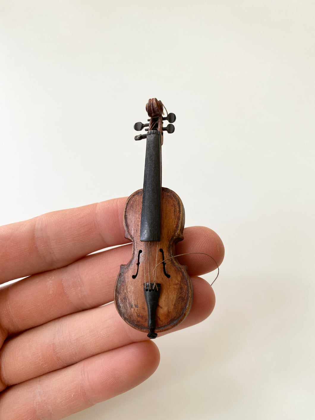Miniature carved violin